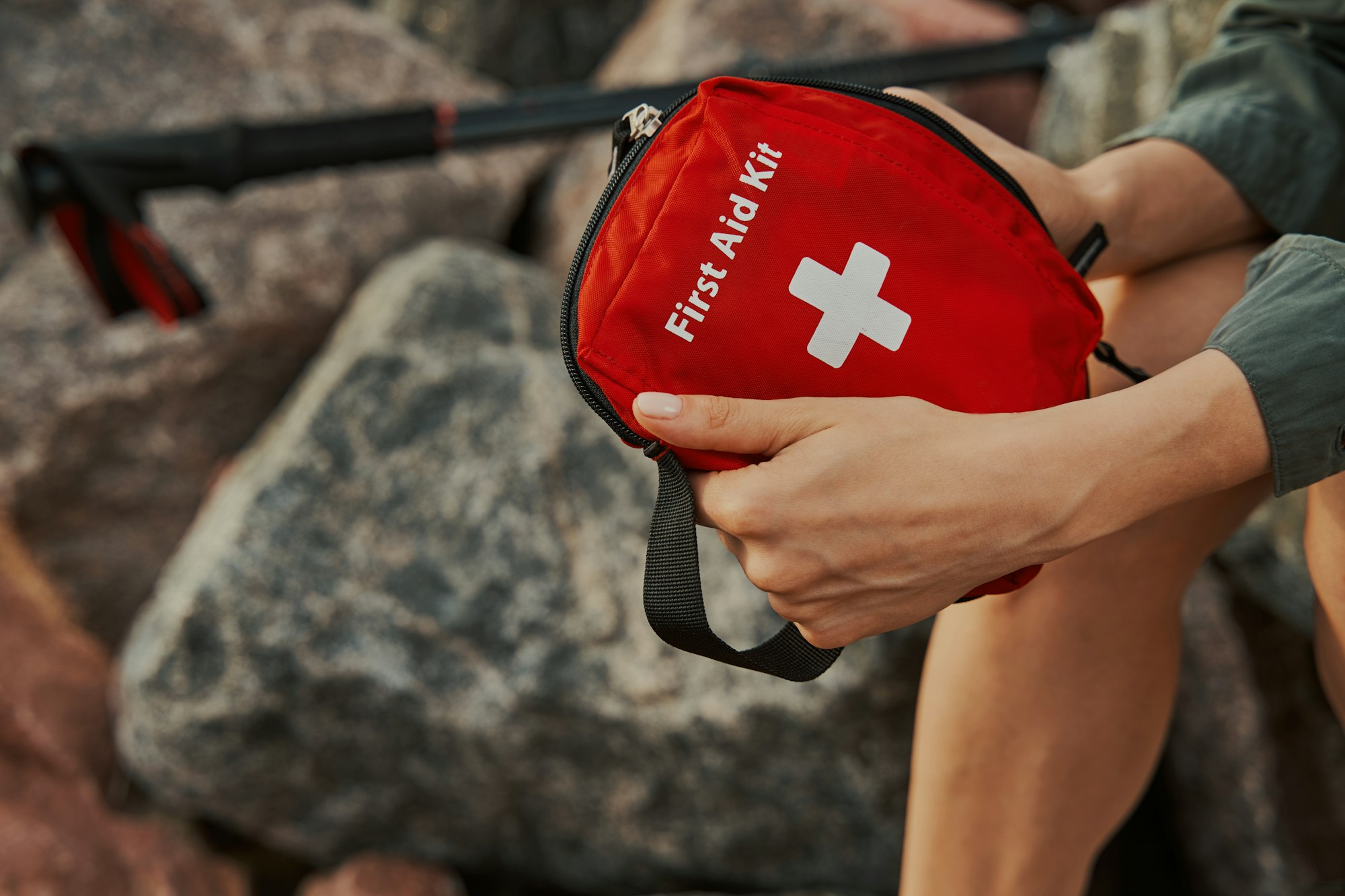 First aid kit in hands of a tourist